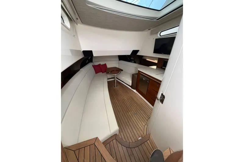 Slide: The Image of Luxurious interior of 2023 Boston Whaler 420 Outrage with elegant seating and modern amenities. - 26