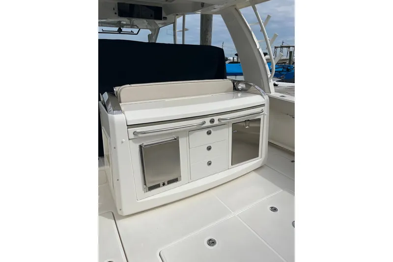 Slide: The Image of 2023 Boston Whaler 420 Outrage interior with sleek cabinetry and modern design. - 25