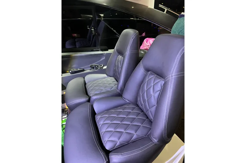 Slide: The Image of Luxurious leather seats in a 2016 Princess V39 yacht interior. - 33