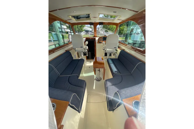 Slide: The Image of Interior of 2014 Hinckley Talaria 34 yacht with elegant seating and helm station. - 5
