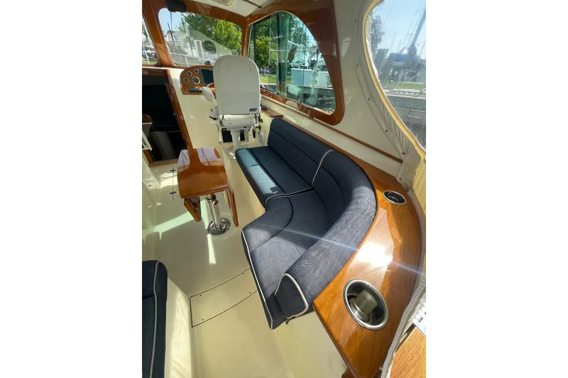 Slide: The Image of Luxurious interior of 2014 Hinckley Talaria 34 yacht with elegant seating and polished wood finishes. - 6