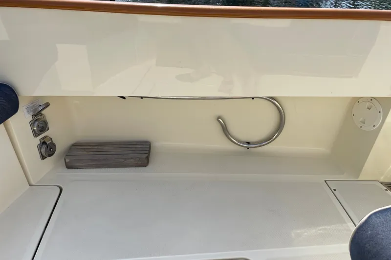 Slide: The Image of Hinckley Talaria 34, 2014 model, boat interior detail with utility fixtures and wooden trim. - 19