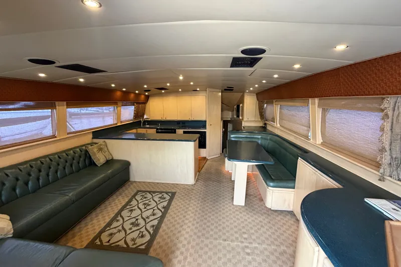 Slide: The Image of Luxurious interior of a 1991 Bertram 60 Convertible yacht with spacious seating and modern amenities. - 28