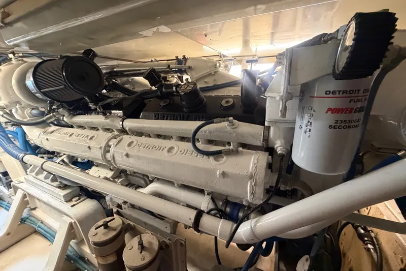 Slide: The Image of Engine room of a 1991 Bertram 60 Convertible with Detroit Diesel engine components. - 20