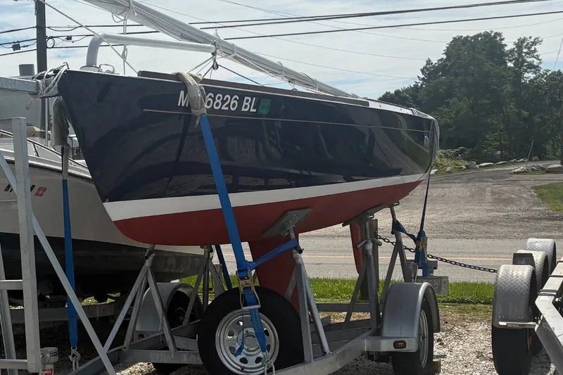 Slide: The Image of 2019 Alerion Express 20 sailboat on trailer, parked outdoors. - 5