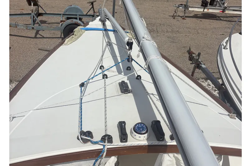 Slide: The Image of 2019 Alerion Express 20 sailboat deck with rigging and compass. - 12