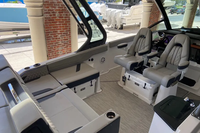 Slide: The Image of Luxurious interior of 2027 Monterey Elite 27 OB boat with plush seating and modern design. - 13