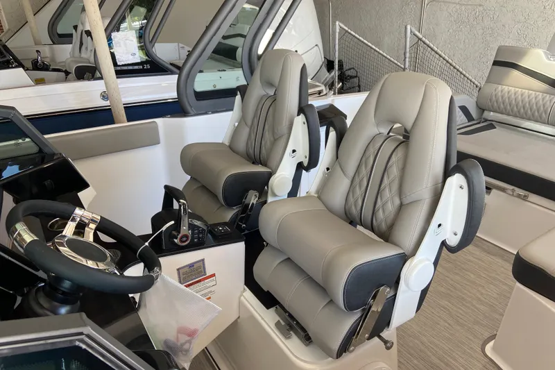 Slide: The Image of Luxury seating in 2027 Monterey Elite 27 OB boat cockpit, featuring modern design and comfort. - 15