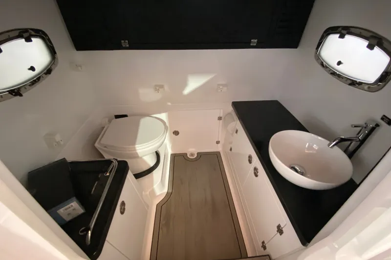 Slide: The Image of Luxurious bathroom in 2027 Monterey Elite 27 OB boat with modern fixtures. - 22