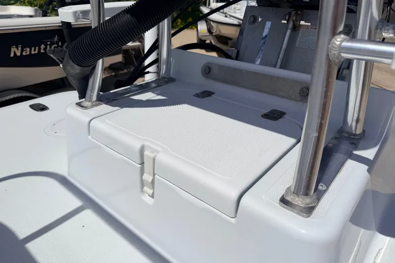 Slide: The Image of 2011 NewWater Ibis boat deck with storage compartment and metal railing. - 27