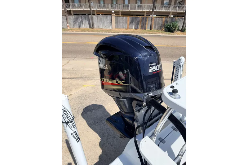 Slide: The Image of Outboard motor on 2011 NewWater Ibis boat, featuring Yamaha 200 HP engine. - 25