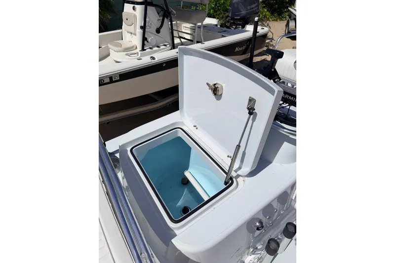 Slide: The Image of Open storage compartment on 2011 NewWater Ibis boat, showcasing interior details. - 21