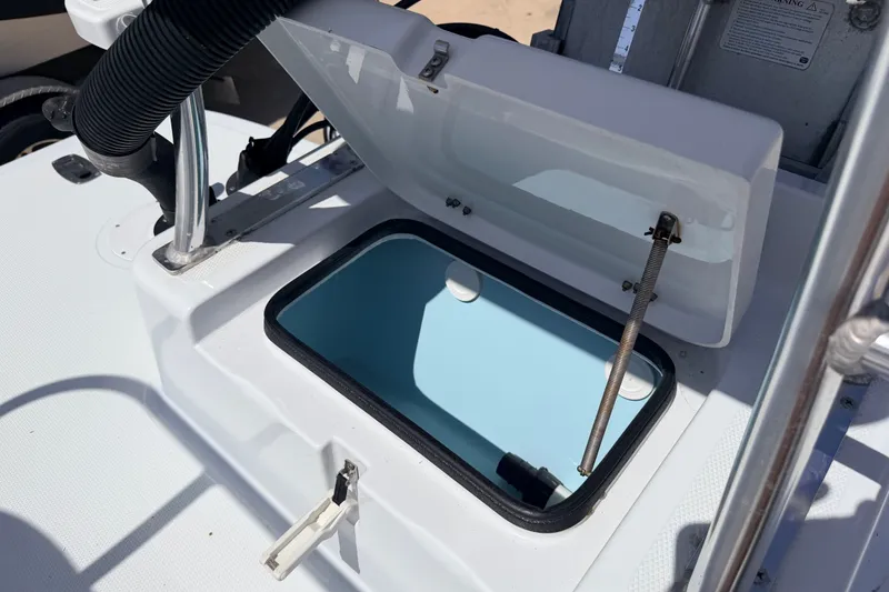 Slide: The Image of Open storage compartment on 2011 NewWater Ibis boat, featuring a sleek design. - 28