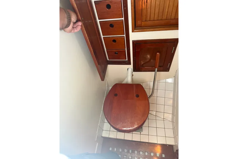 Slide: The Image of Wooden yacht bathroom interior with storage, featuring Hinckley Yachts Bermuda 40, 1965 model. - 19