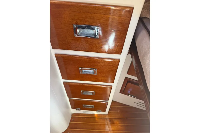 Slide: The Image of Wooden drawers inside a 1965 Hinckley Yachts Bermuda 40, showcasing classic nautical craftsmanship. - 20