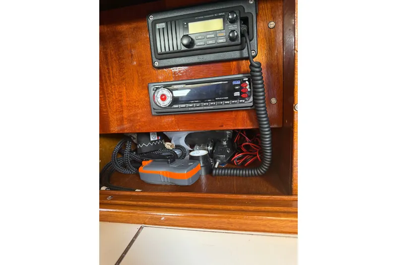 Slide: The Image of 1965 Hinckley Yachts Bermuda 40 interior electronics panel with radio and wiring. - 21