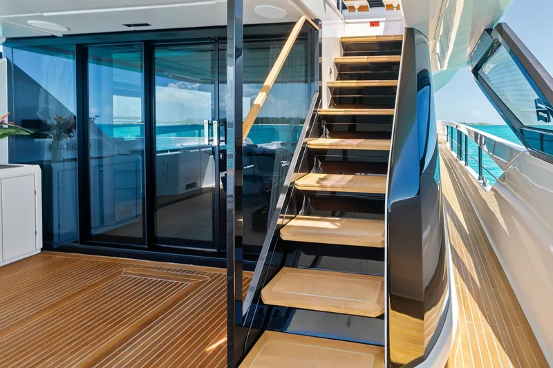 Slide: The Image of Luxurious 2024 Ferretti Yachts 860 with elegant wooden deck and modern staircase. - 28