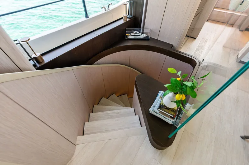 Slide: The Image of Luxurious interior of 2024 Ferretti Yachts 860 with elegant staircase and modern decor. - 71
