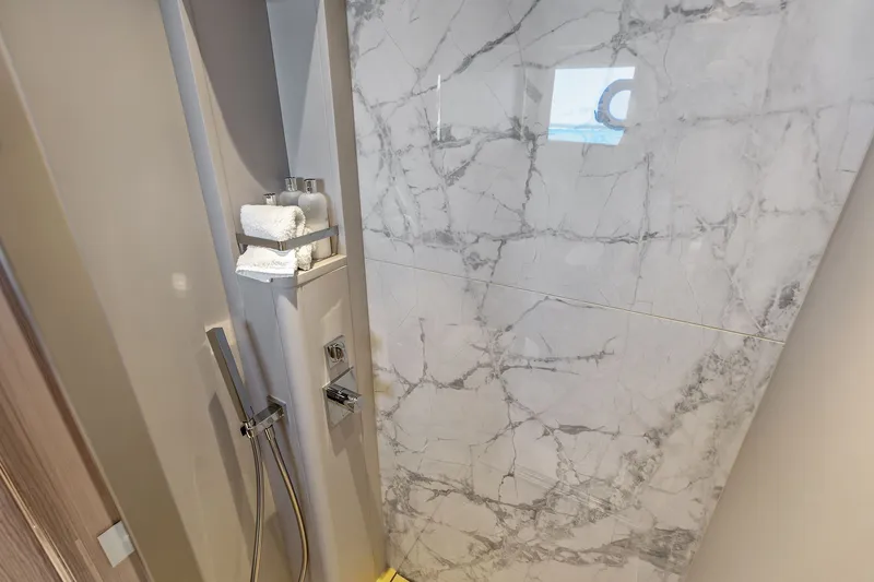 Slide: The Image of Luxurious marble shower in 2024 Ferretti Yachts 860, featuring modern fixtures and amenities. - 96