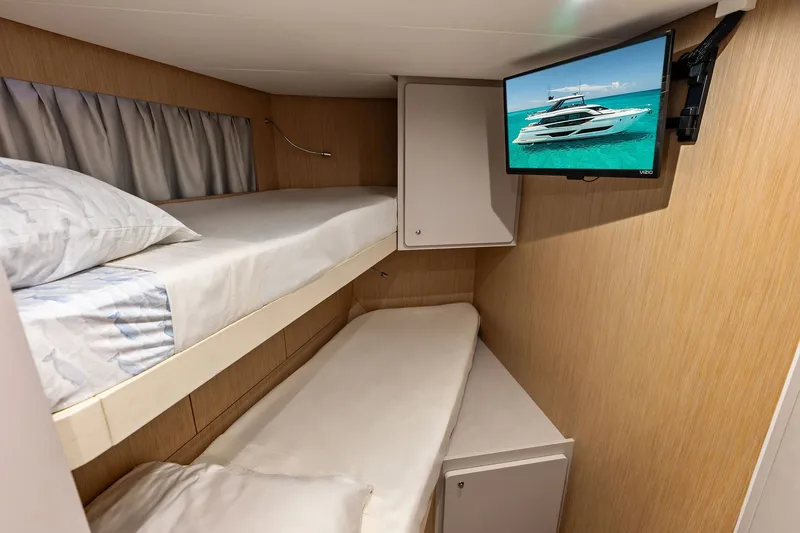 Slide: The Image of Cozy cabin interior of 2024 Ferretti Yachts 860 with bunk beds and wall-mounted TV. - 107