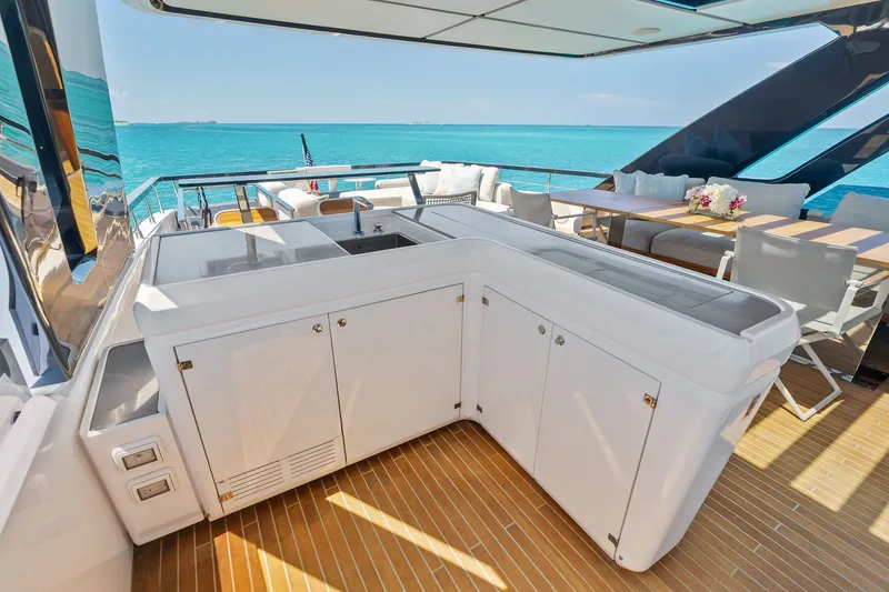Slide: The Image of Luxurious 2024 Ferretti Yachts 860 deck with outdoor kitchen and ocean view. - 42