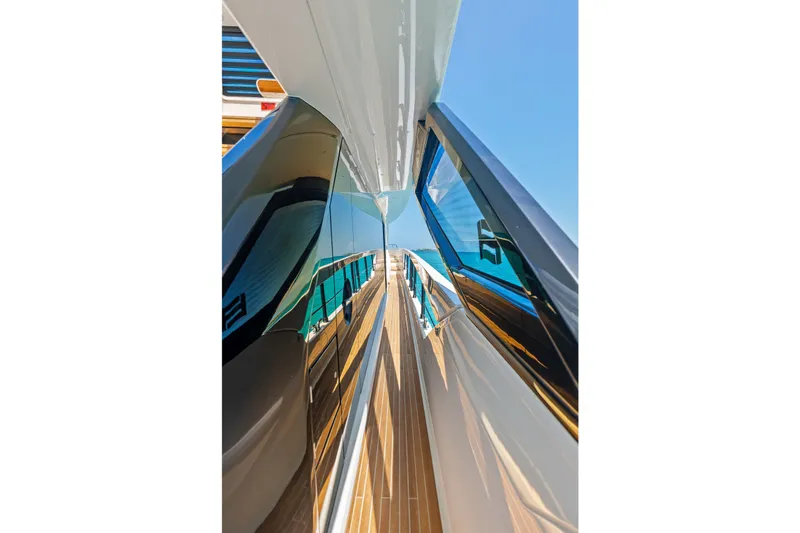 Slide: The Image of Side view of 2024 Ferretti Yachts 860, showcasing sleek design and reflective surfaces. - 29