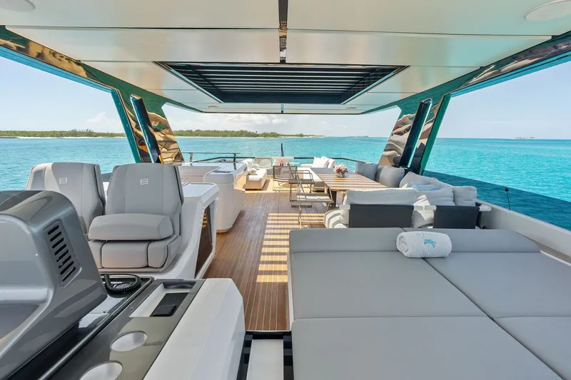 Slide: The Image of Luxurious 2024 Ferretti Yachts 860 interior with ocean view and elegant seating. - 41