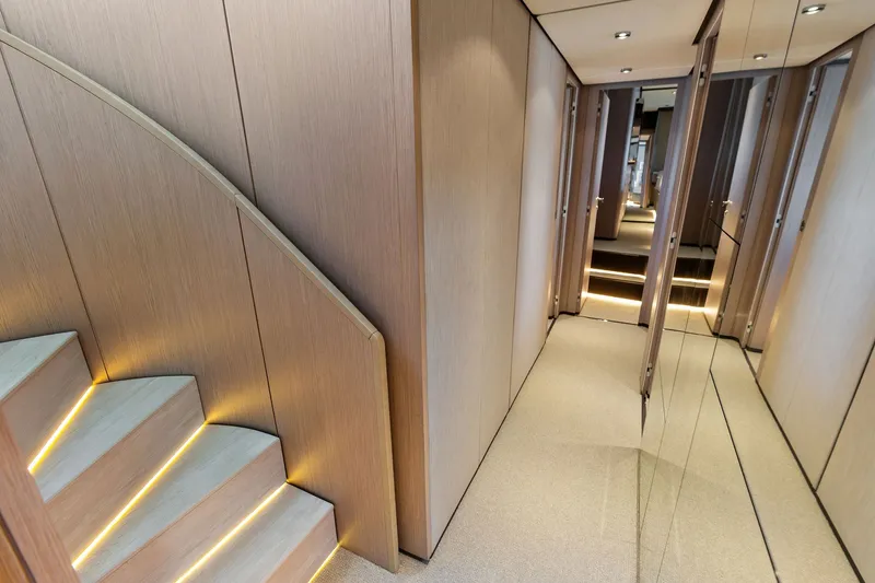 Slide: The Image of Luxurious interior hallway of 2024 Ferretti Yachts 860 with elegant lighting and mirrored walls. - 85