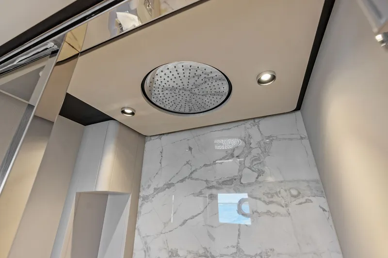 Slide: The Image of Luxurious shower area in 2024 Ferretti Yachts 860 with marble walls and modern fixtures. - 95