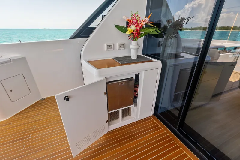 Slide: The Image of Luxurious 2024 Ferretti Yachts 860 interior with elegant cabinetry and ocean view. - 50
