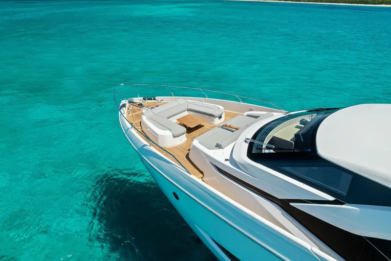 Slide: The Image of Luxurious 2024 Ferretti Yachts 860 cruising on clear turquoise waters. - 5