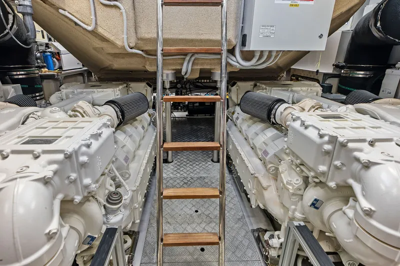 Slide: The Image of Engine room of 2024 Ferretti Yachts 860, featuring dual engines and ladder access. - 109
