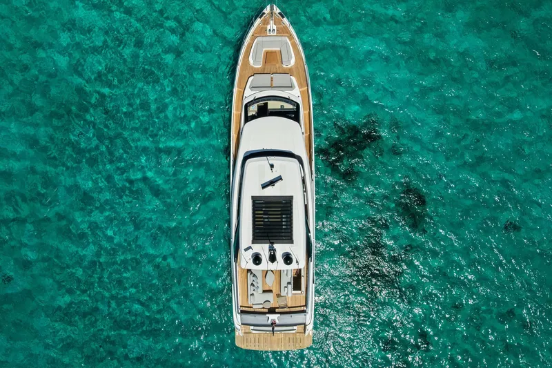 Slide: The Image of Top view of 2024 Ferretti Yachts 860 on clear turquoise water. - 7