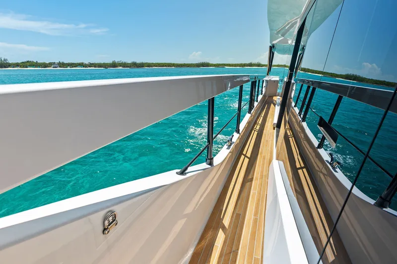 Slide: The Image of Luxurious 2024 Ferretti Yachts 860 cruising on turquoise waters, showcasing sleek deck design. - 36
