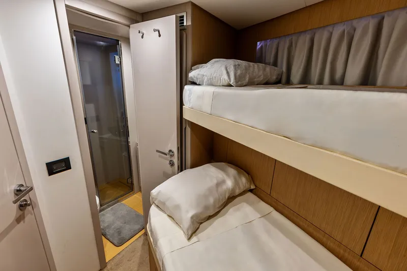 Slide: The Image of 2024 Ferretti Yachts 860 cabin with bunk beds and ensuite bathroom. - 106