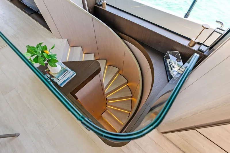 Slide: The Image of Luxurious interior staircase of 2024 Ferretti Yachts 860 with elegant lighting and decor. - 72