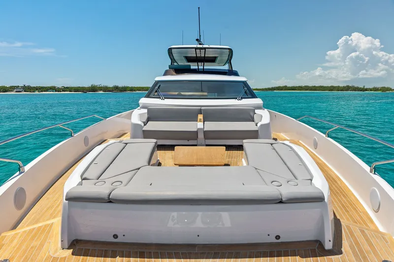 Slide: The Image of Luxurious 2024 Ferretti Yachts 860 on serene blue waters, featuring spacious deck seating. - 33