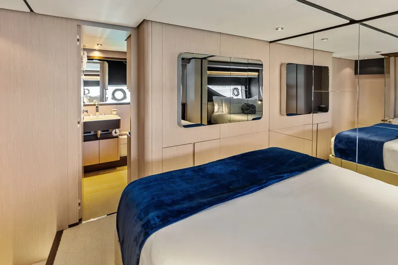 Slide: The Image of Luxurious bedroom interior of 2024 Ferretti Yachts 860 with modern design and ensuite bathroom. - 100