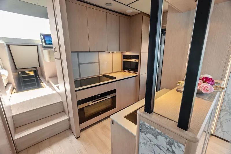 Slide: The Image of Luxurious kitchen interior of 2024 Ferretti Yachts 860, featuring modern appliances and elegant design. - 63