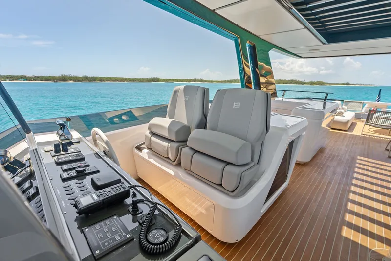 Slide: The Image of Luxurious 2024 Ferretti Yachts 860 helm station with ocean view and modern controls. - 46