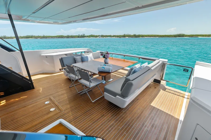 Slide: The Image of Luxurious 2024 Ferretti Yachts 860 deck with elegant seating and ocean view. - 27