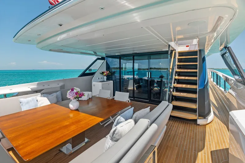Slide: The Image of Luxurious 2024 Ferretti Yachts 860 deck with elegant seating and ocean view. - 49