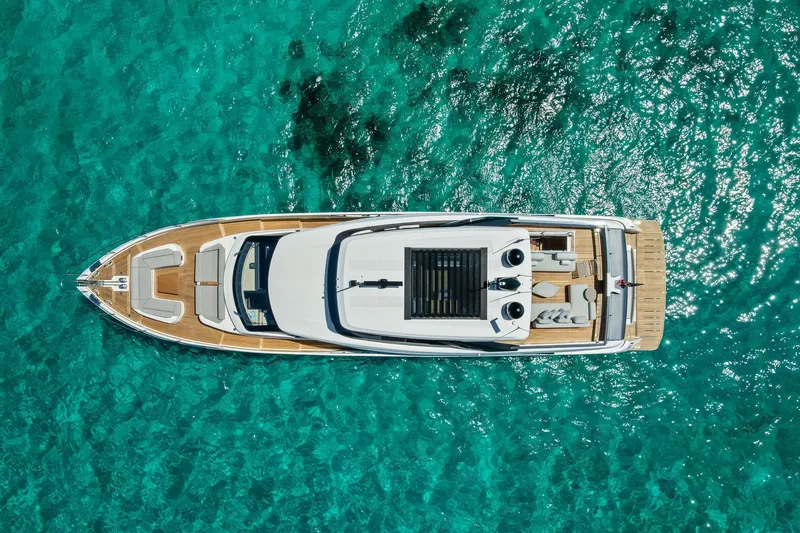 Slide: The Image of Aerial view of 2024 Ferretti Yachts 860 on clear turquoise water. - 8
