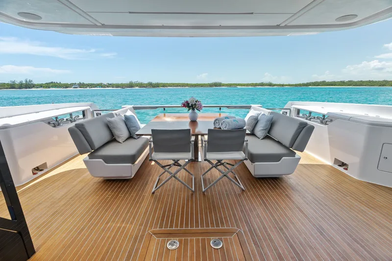 Slide: The Image of Luxurious 2024 Ferretti Yachts 860 deck with elegant seating and ocean view. - 53