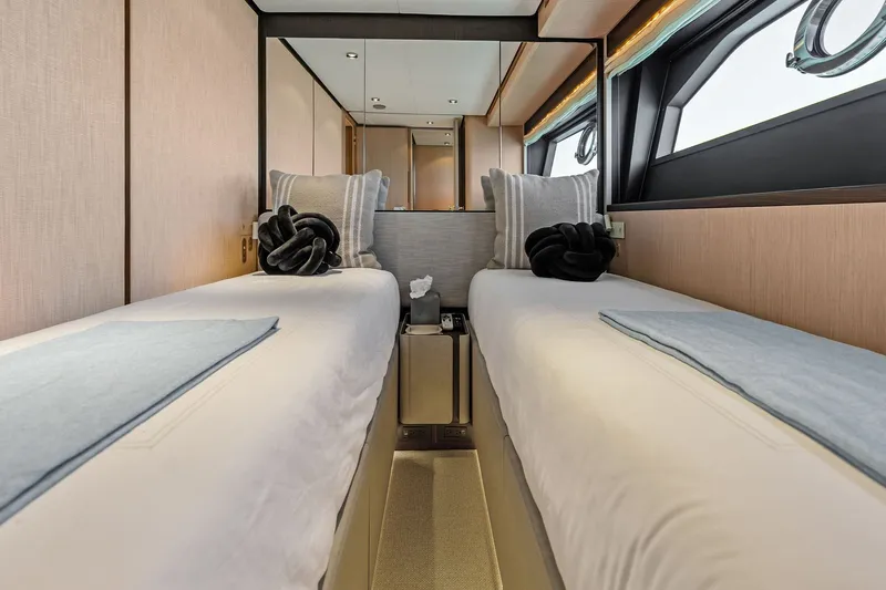 Slide: The Image of Luxurious twin cabin interior of 2024 Ferretti Yachts 860 with elegant bedding and decor. - 92