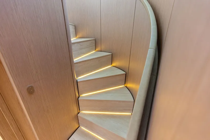Slide: The Image of Curved staircase with ambient lighting on 2024 Ferretti Yachts 860. - 73