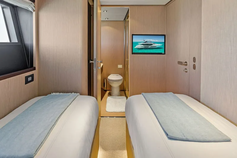 Slide: The Image of Luxurious 2024 Ferretti Yachts 860 cabin interior with twin beds and modern amenities. - 93
