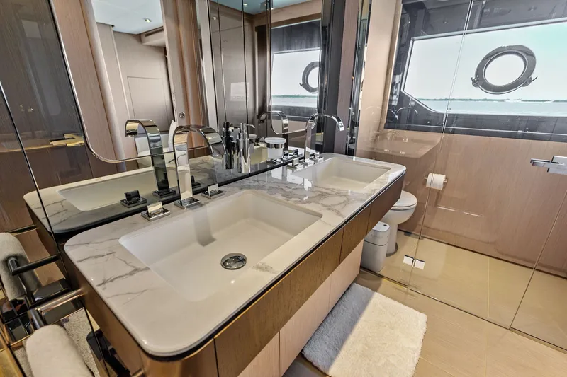 Slide: The Image of Luxurious bathroom interior of 2024 Ferretti Yachts 860 with marble sink and modern fixtures. - 81