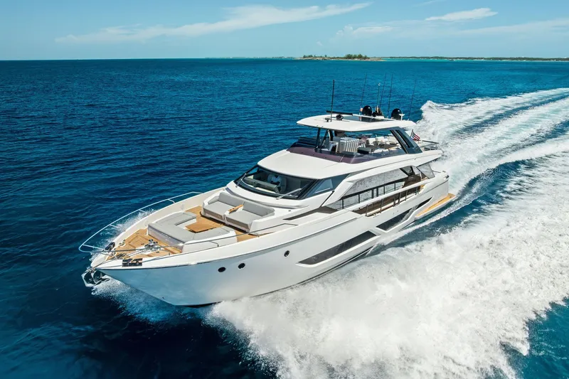 Slide: The Image of Luxurious 2024 Ferretti Yachts 860 cruising on open blue sea. - 11
