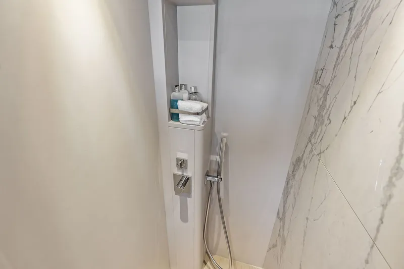 Slide: The Image of Luxurious shower area in 2024 Ferretti Yachts 860, featuring marble walls and modern fixtures. - 90